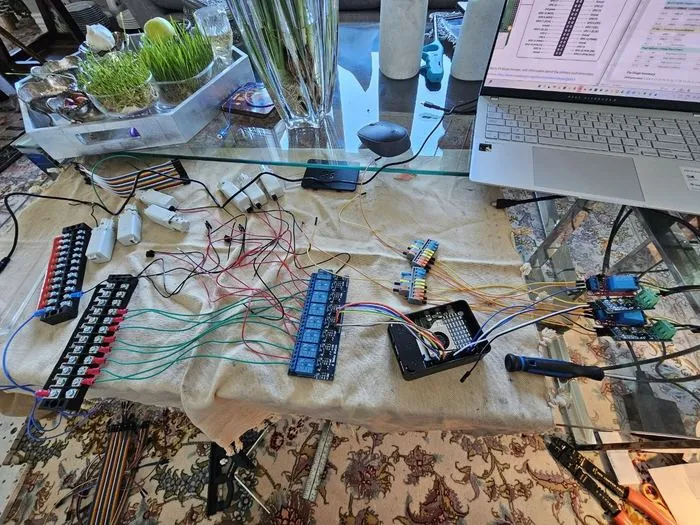 Terminal blocks and relay modules laid out and wired on the bench prior to being mounted in the case.